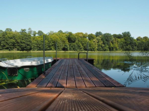 Lake Cottage with Fireplace, Jetty, Boat and Sauna in West Masuria